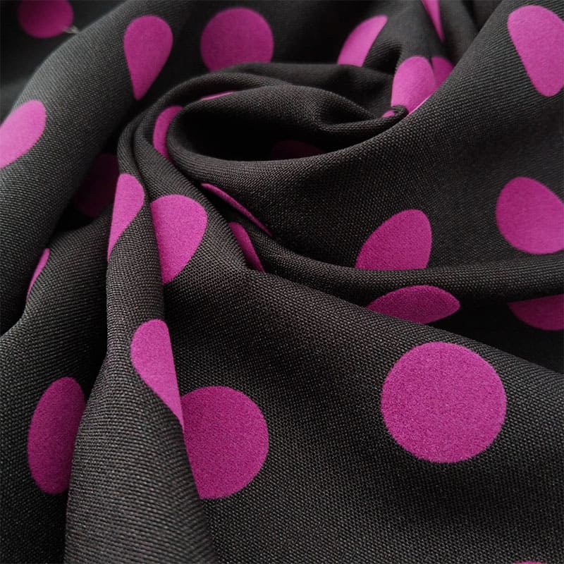 Tela en negro lunar color fucsia flocado - Imagen 3